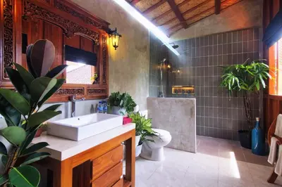 a bathroom with a sink and a toilet at The Cottage By Selasih in Seminyak