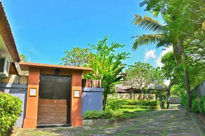 a small house with a door on a street at Private Pool Villas Kuta Bali in Badung