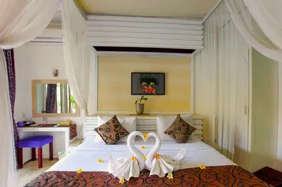 a bedroom with a bed with two hearts on it at Private Pool Villas Kuta Bali in Badung