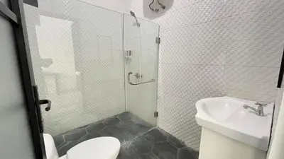 a bathroom with a shower and a toilet and a sink at 2 Bedrooms Villa Petitenget Private Pool in Seminyak