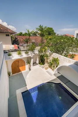 an aerial view of a house with a swimming pool at Villa Batu Putih 3 Seminyak in Seminyak