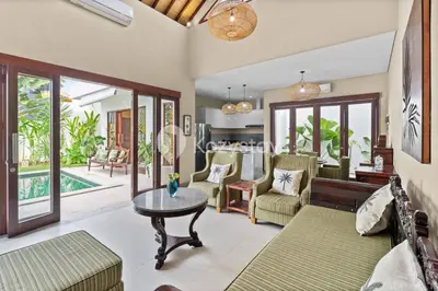 a living room with a couch and a table at Andrew Villa by Kozystay - Umalas in Canggu