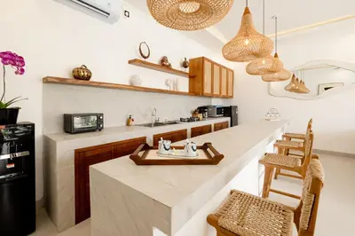 a kitchen with a large island in a room at Brand new - spacious complex Villas Virland - center Seminyak in Seminyak