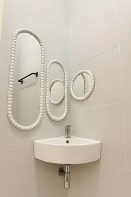 a bathroom with a sink and a mirror at Villa Cempaka - Pemogan in Denpasar
