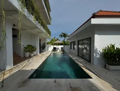 an external view of a house with a swimming pool at ChinGiack Apartments Canggu Pool and Terrace in Canggu