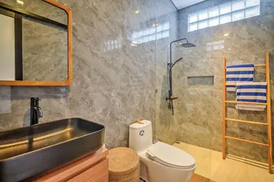 a bathroom with a sink and a toilet and a shower at Villa Esha I in Seminyak