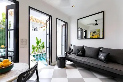 a living room with a couch and a table at Martini Beachside Villa 6 in Canggu
