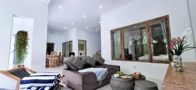 a living room with a couch and a table at Tropical 2br private pool Villa in central Seminyak in Seminyak