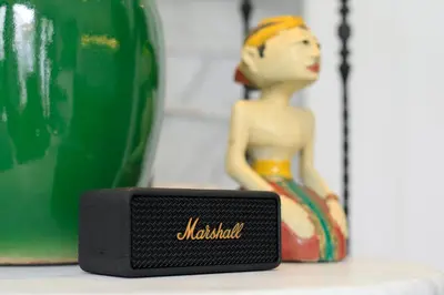 a small black device sitting on a table next to a bottle at Martini Beachside Villa 7 in Canggu