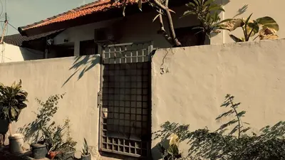 a wall with a window on the side of a house at kerobokan cozy house by kenta in Seminyak