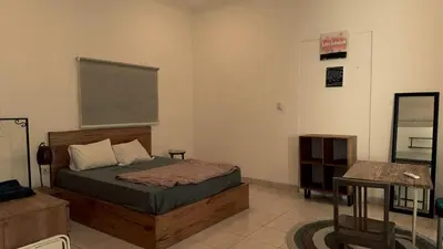 a bedroom with a bed and a chalkboard on the wall at kerobokan cozy house by kenta in Seminyak