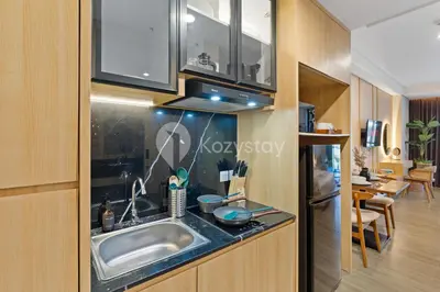 a kitchen with a sink and a counter top at Rivana by Kozystay - Nusa Dua in Nusa Dua