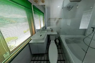 a bathroom with a toilet and a sink and a tub at Villa 9 in Seminyak