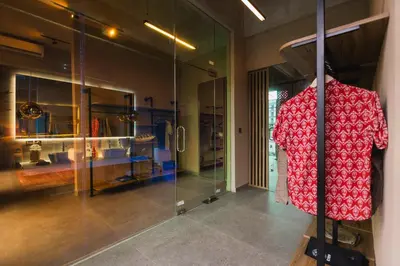a display case with a red dress in a room at DUNE ARRAKIS villas in Seminyak