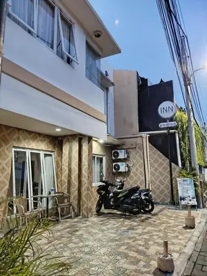 a motorcycle parked in front of a building at Easton Homestay in Ngurah Rai International Airport