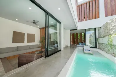 a swimming pool in a house at Villa Kiri - Modern 2BR Hideaway Rooftop & Private Pool in Seminyak