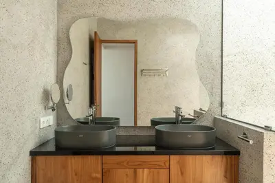 a bathroom with two sinks and a large mirror at Ben's Villa 1 by Alfred in Bali in Kerobokan