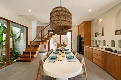 a kitchen and dining room with a table and chairs at Levan Villa Seminyak in Seminyak