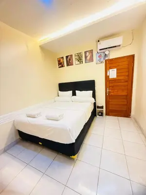 a bedroom with a bed in a room at Room in Guest House near Kuta Beach Bali in Pesanggaran