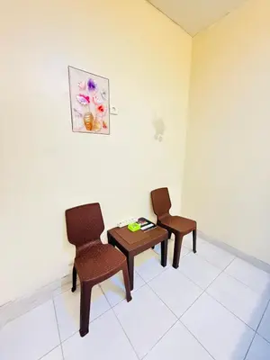 two chairs and a table in a room at Room in Guest House near Kuta Beach Bali in Pesanggaran