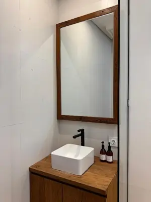 a bathroom with a white sink and a mirror at Tuluscoliving Villa Kuta 1, 4 Bedroom & 5 Bathroom in Ngurah Rai International Airport