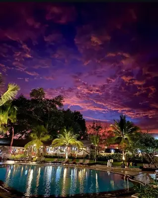 a night view of a swimming pool at a resort at The Palmana Tropical Garden Jayakarta Residence 36 in Seminyak