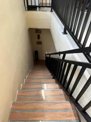 a staircase leading up to the top of a building at Hustlers paradise in Bali in Kerobokan