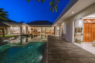 an indoor swimming pool in a house at night at PROMO - 4 Bedroom Designer Villa 2 minutes to Berawa Beach & Finns in Canggu