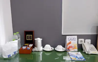 a counter top with some items on top of it at AI Hotel Kuta - 15 Second to the Beach and 1 Minute to Airport by Micky Studio in Ngurah Rai International Airport