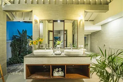 a bathroom with two sinks and a large mirror at Coral Heaven 1 by Bali Villa Solutions in Seminyak