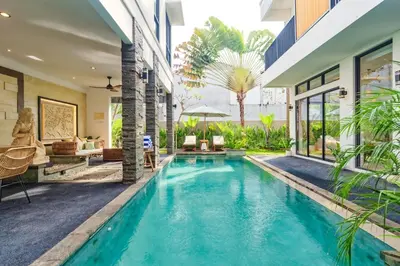 a swimming pool in the middle of a house at Villa Club Residence 8 by Maheswara in Canggu