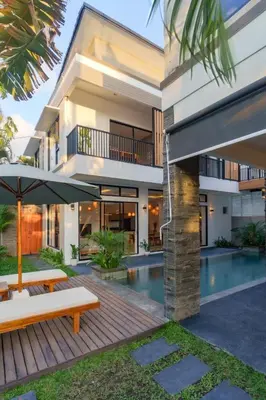 an exterior view of a house with a swimming pool at Villa Club Residence 8 by Maheswara in Canggu