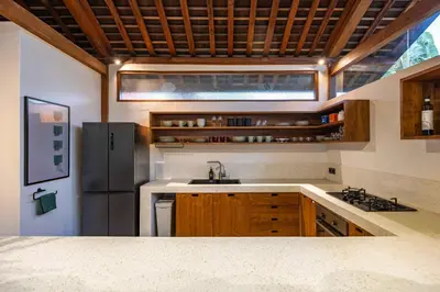 a kitchen with a sink and a refrigerator at Villa Camini - Newly Renovated Beautiful 2BR Family Villa 6px With Garden And Private Pool in Kerobokan