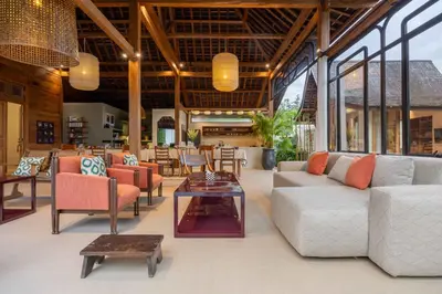 a lobby with couches and chairs and a table at Villa Camini - Newly Renovated Beautiful 2BR Family Villa 6px With Garden And Private Pool in Kerobokan