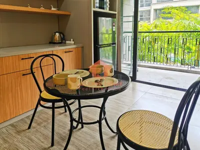 a table with a plate of food on it in a kitchen at Lavaya Resort 1BR Nusa Dua with Pool, WiFi, Netflix by 2ndHome in Nusa Dua