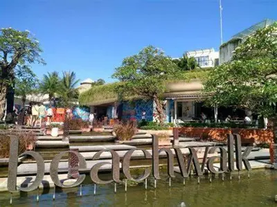 a building with a bunch of benches in the water at SH Hotel - 20 Second to the Bach by Micky Studio R in Legian