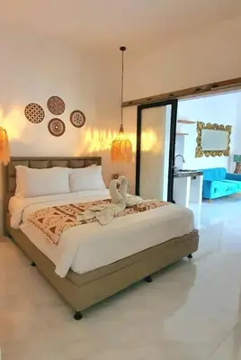 a bedroom with a large bed with a large window at Villa TJ Subali 3 BR privatepool close to Seminyak in Seminyak