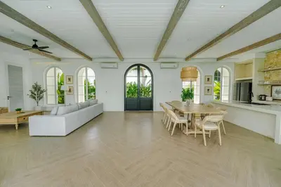 a large living room with a table and a couch at Villa Aclasa Luxery 4BR Retreat in Berawa, Canggu in Canggu