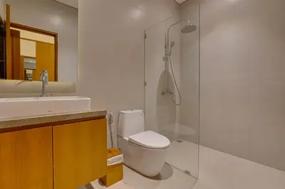a bathroom with a shower and a toilet and a sink at New! Villa Taman Seminyak 01 near Double Six Beach in Seminyak
