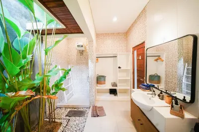 a bathroom with a tub and a sink and a shower at Peaceful private 3BR pool villa in heart of Bali in Legian
