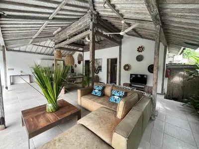 a living room with a couch and a table at Villa Louise in Badung