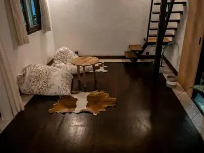 a living room with a table and a leaf on the floor at My secret home ( full villa) in Seminyak