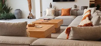 a living room with couches and a coffee table at Villa Trindade 5BR, 15m Pool in Seminyak