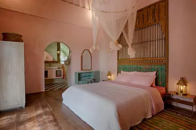 a bedroom with a large bed in a room at Villa Inde Noi - Beautiful stylish bohemian 2bdrs villa - Kerobokan in Kerobokan