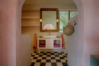 a bathroom with a sink and a mirror at Villa Inde Noi - Beautiful stylish bohemian 2bdrs villa - Kerobokan in Kerobokan