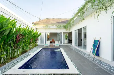 a swimming pool in the backyard of a house at The Kakadu - A new modern 2BR Villa with private pool in Seminyak in Seminyak