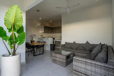 a living room with a couch and a table at The Kakadu - A new modern 2BR Villa with private pool in Seminyak in Seminyak