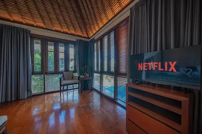 an office with a netflix sign in a room with windows at Villa Wibisana Beachside Luxury in Seminyak in Seminyak