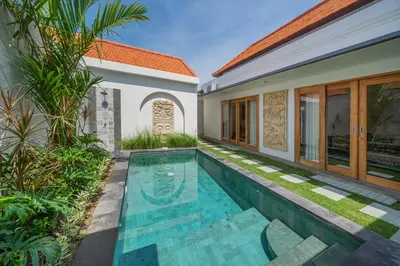 an image of a swimming pool in the backyard of a house at Villa Mailaku Seminyak in Seminyak