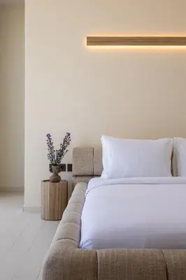 a bedroom with a bed and a couch at Villa Oasia 1 Seminyak in Seminyak